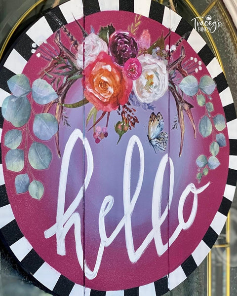 Dixie Belle Paint Plum Crazy Chalk Mineral Paint is the perfect paint for any DIY project! Wood sign chalk painted with maroon and purple blended together in the middle and black and white stripes on the edges. White hello is painted in the middle with floral rub on transfers.