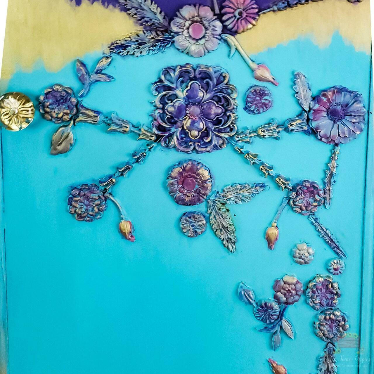 Dixie Belle Paint Pure Ocean Chalk Mineral Paint is the perfect paint for any DIY project! Up close of a blue chalk painted furniture with purple flowers.