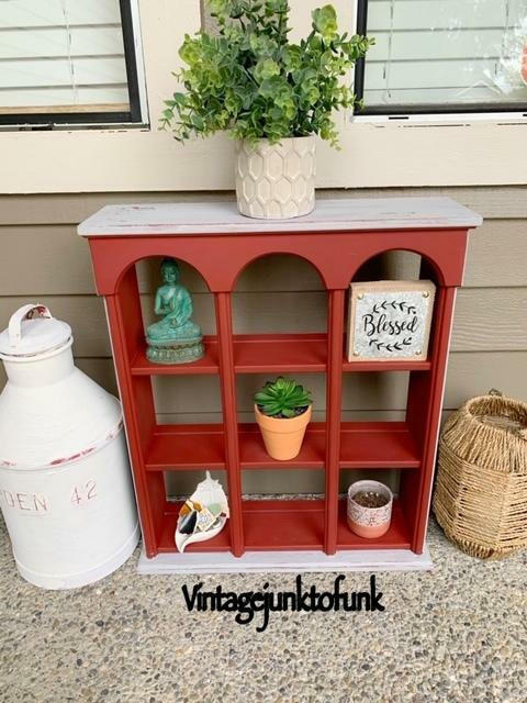 Dixie Belle Paint Rustic Red Chalk Mineral Paint is the perfect paint for any DIY project! A decor shelf painted in rustic red and is staged with various household items.