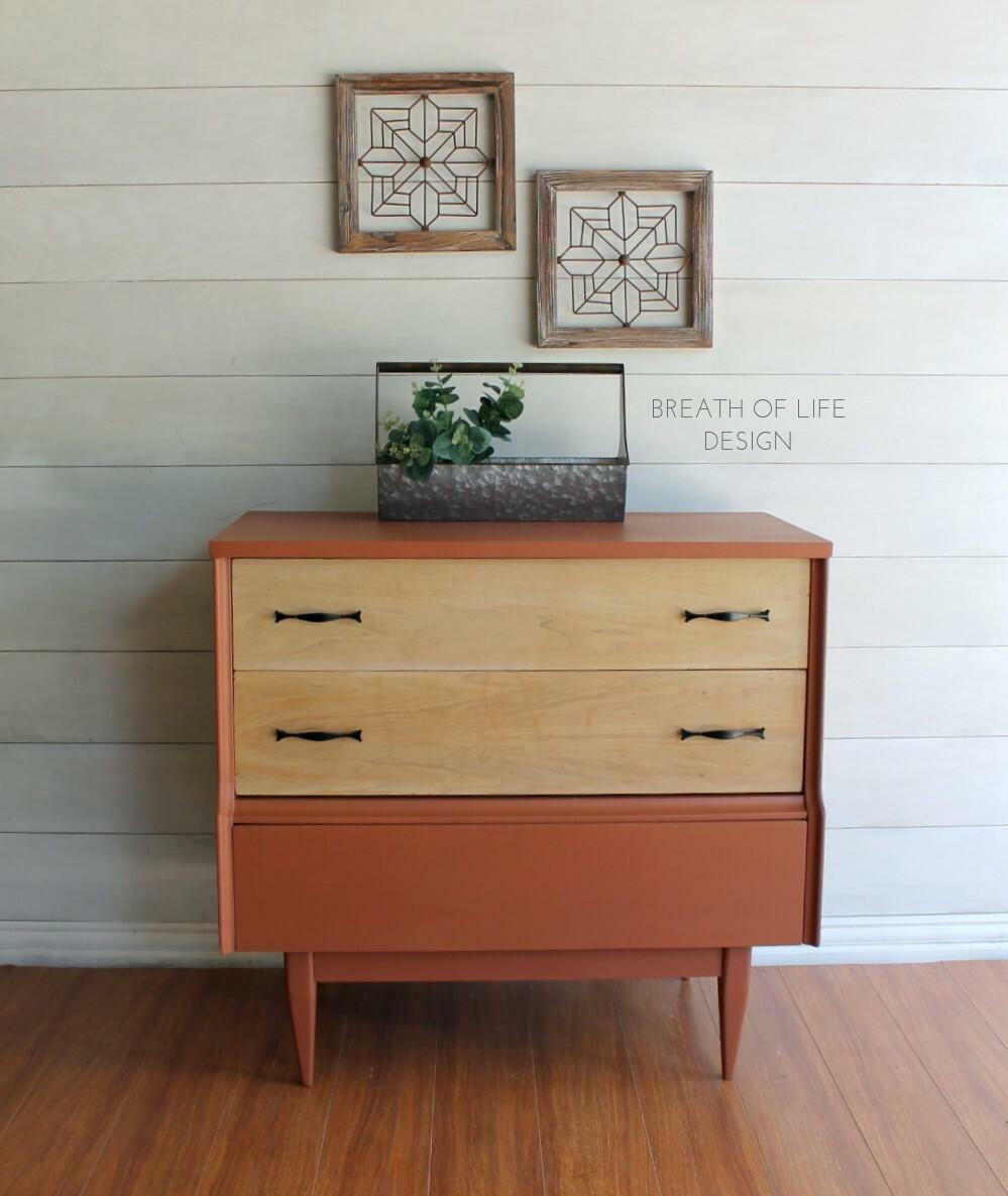 Dixie Belle Paint Rusty Nail Chalk Mineral Paint is the perfect paint for any DIY project! An MCM dresser that is painted in the rusty nail and has natural toned wooden drawers.
