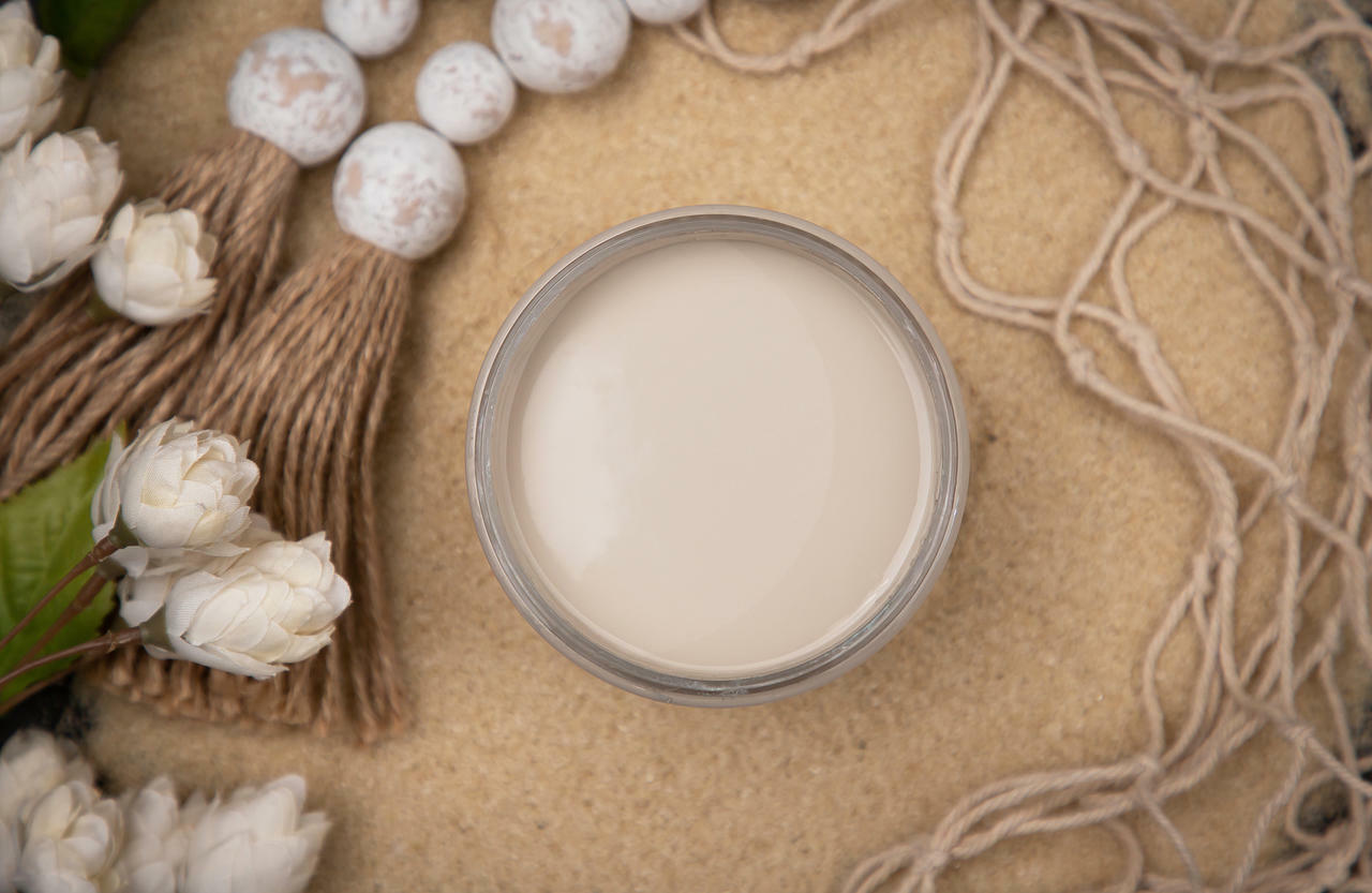 Dixie Belle Paint Sand Bar Chalk Mineral Paint is the perfect paint for any DIY project! An image of the sand bar paint jar that is opened and staged.