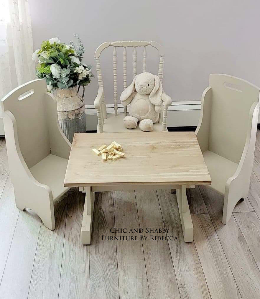 Dixie Belle Paint Sand Bar Chalk Mineral Paint is the perfect paint for any DIY project! A little wooden play set for children that is painted in sand bar and staged with kid toys, such as a rabbit.