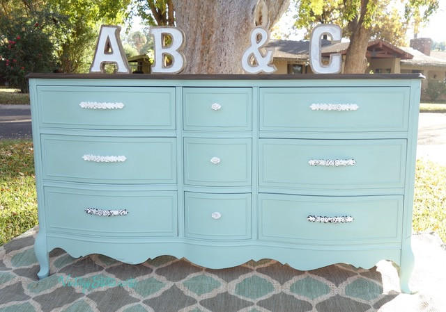 Dixie Belle Paint Sea Glass Chalk Mineral Paint is the perfect paint for any DIY project! A dresser painted in sea glass with silver hardware and is staged outside.