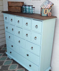 Dixie Belle Paint Sea Glass Chalk Mineral Paint is the perfect paint for any DIY project! A dresser with 17 drawers painted in sea glass.