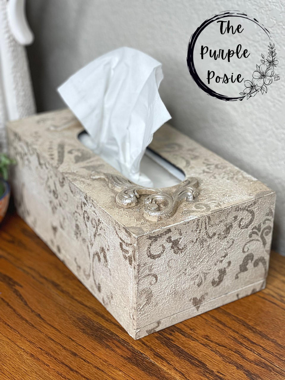 Dixie Belle Paint Sea Spray creates a chippy, textured & weathered look when mixed with your favorite Dixie Belle color. A beige painted tissue box with a stencil in a darker brown with sea spray added to show texture.