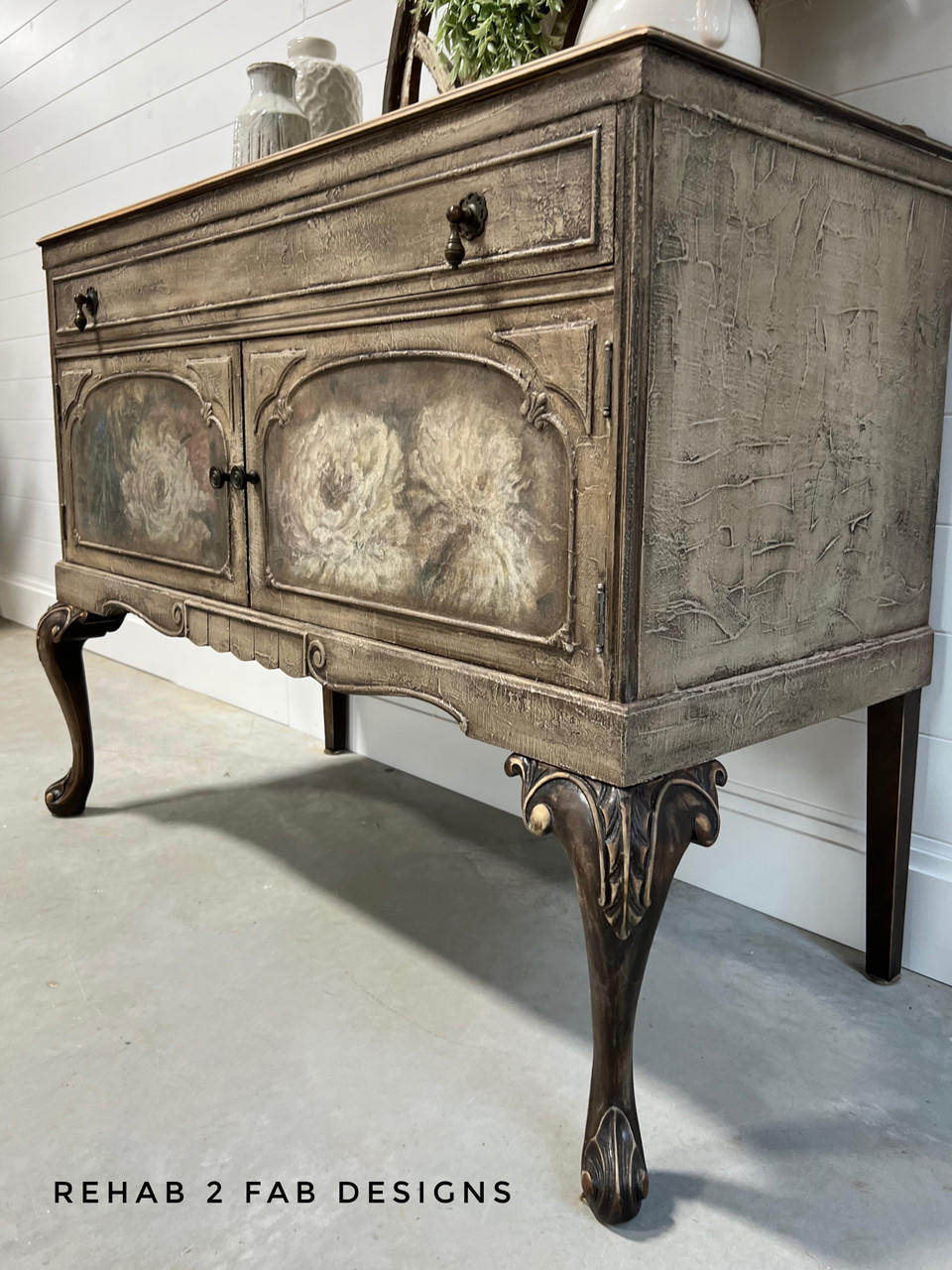 Dixie Belle Paint Sea Spray creates a chippy, textured & weathered look when mixed with your favorite Dixie Belle color. A dresser cabinet that is painted in a neutral beige tone with sea spray added to show texture.