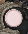 Dixie Belle Paint Soft Pink Chalk Mineral Paint is the perfect paint for any DIY project! A staged product image with an open jar of our soft pink chalk mineral paint.