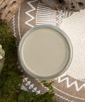 Dixie Belle Paint Spanish Moss Chalk Mineral Paint is the perfect paint for any DIY project! A staged product image of an open can of paint, spanish moss chalk mineral paint.