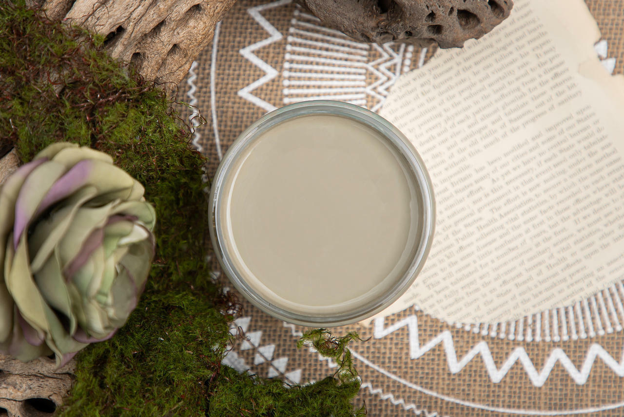 Dixie Belle Paint Spanish Moss Chalk Mineral Paint is the perfect paint for any DIY project! A staged product image of an open can of paint, spanish moss chalk mineral paint.