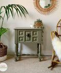 Dixie Belle Paint Spanish Moss Chalk Mineral Paint is the perfect paint for any DIY project! A funky side table with deep engraving on the front and is painted in spanish moss chalk mineral paint.