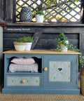 Dixie Belle Paint Stormy Seas Chalk Mineral Paint is the perfect paint for any DIY project!
Beautiful low cabinet painted in Stormy Seas Chalk Mineral Paint with natural wood hardware and top. Staged with flower pots and greenery.