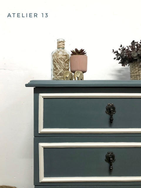Dixie Belle Paint Stormy Seas Chalk Mineral Paint is the perfect paint for any DIY project!
Corner view of a dresser painted in Stormy Seas Chalk Mineral Paint with the borders of the drawers in white and black hardware.