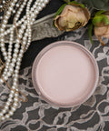 Dixie Belle Paint Tea Rose Chalk Mineral Paint is the perfect paint for any DIY project!
Opened container of Tea Rose Chalk Mineral Paint staged with pearls, lace cloth, and roses.