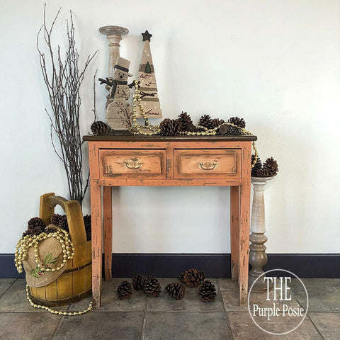 Dixie Belle Paint Terracotta Chalk Mineral Paint is the perfect paint for any DIY project!  A brown chalk painted and distressed hallway table with pine cones, baskets and winter decorations.