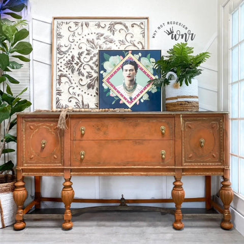 Dixie Belle Paint Terracotta Chalk Mineral Paint is the perfect paint for any DIY project!  A brown chalk painted buffet with dark antiqued edges and gold pull knobs.