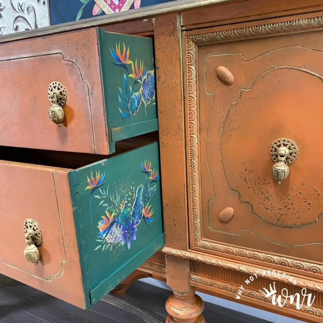 Dixie Belle Paint Terracotta Chalk Mineral Paint is the perfect paint for any DIY project!  A brown chalk painted buffet table with rub-on furniture transfers applied to the sides of the drawers.
