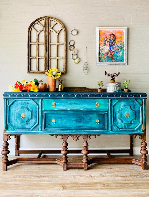 Dixie Belle Paint The Gulf Chalk Mineral Paint chalk painted dresser with a few colors used, staged with flowers and a framed picture