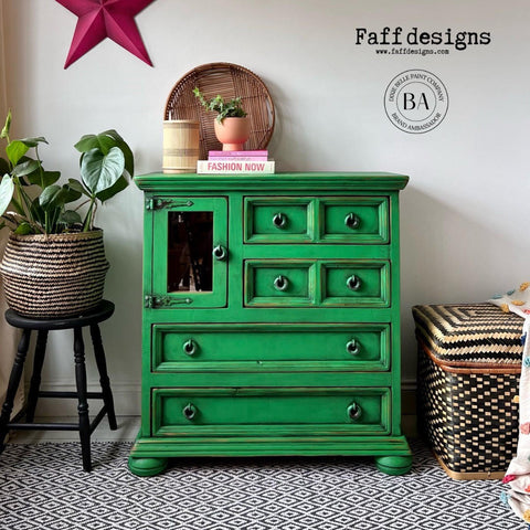 Dixie Belle Paint Tree Frog Green Chalk Mineral Paint is the perfect paint for any DIY project!  A green chalk painted dresser with black edges and chrome pull knobs.