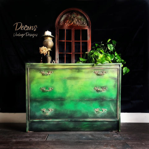 Dixie Belle Paint Tree Frog Green Chalk Mineral Paint is the perfect paint for any DIY project!  A yellow, green and black ombre blended chalk painted dresser with gold handles.
