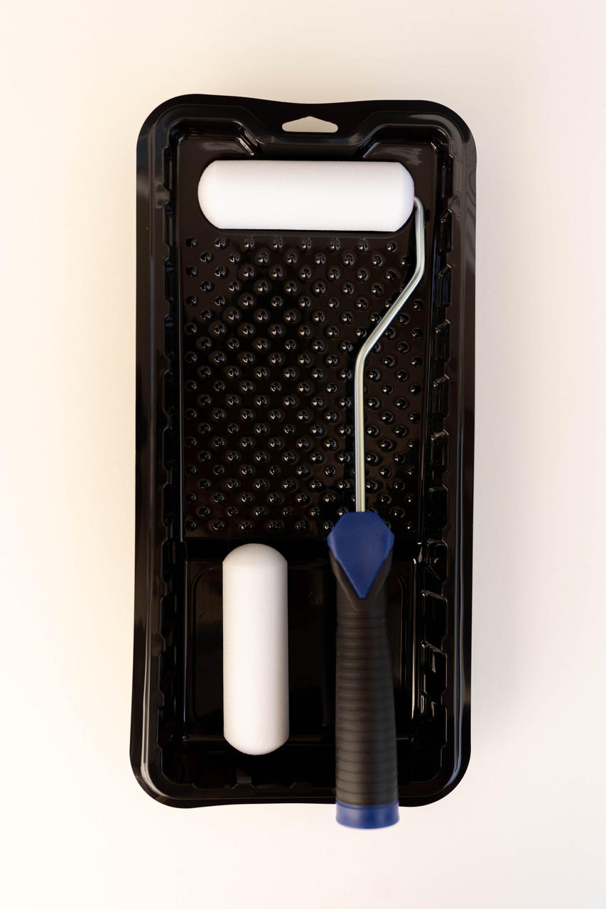 Image of Smooth Roller Kit. One black tray with a blue and black handled roller with a white sponge paint roller on the metal arm. One extra white sponge roller resting in the tray.