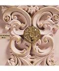 Ornate decorative detail with gold gilding wax on an intricate, swirling design. The background is a soft pink, enhancing the elegant embellishment. A label reads "Gold Gilding Wax" and "GRACIE'S HOUSE Painted Furniture."