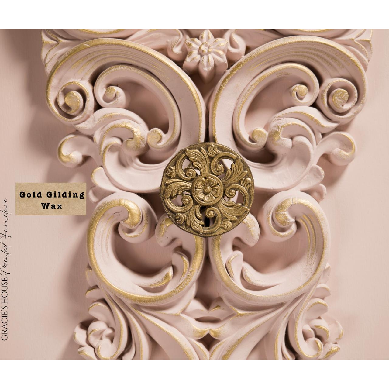 Ornate decorative detail with gold gilding wax on an intricate, swirling design. The background is a soft pink, enhancing the elegant embellishment. A label reads "Gold Gilding Wax" and "GRACIE'S HOUSE Painted Furniture."