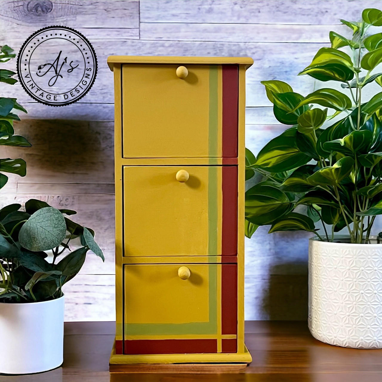 Yellow painted jewelry box with a stripe of Everglades and Sequoia along the right side and the bottom.