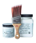 Kitchen Starter Bundle is perfect for a DIY kitchen makeover! close up image that has the Mini angle Brush in the center on the left has an 8oz container of Pristine Clean from the Silk All-in-one Paint with a 32oz Silk All-in-One Mineral Paint in Salt Water on the right, on a white background.