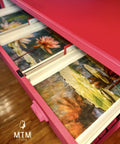 Red painted lingerie cabinet with the Lily Pads Decoupage Paper applied on the inside of the drawers.