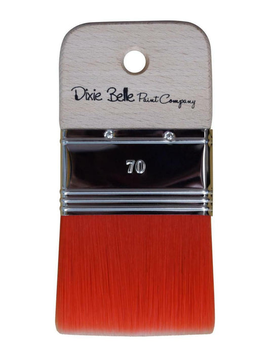 Belles and Whistles Scarlet Brush. A closeup image of our scarlet brush, with red bristles, on a transparent background.