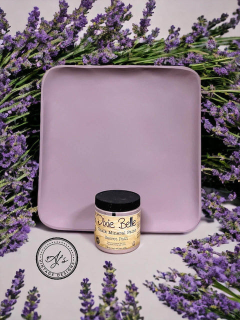 Wooden tray painted with Secret Path Chalk Mineral Paint. Staged with lavender surrounding the wooden tray and paint jar.