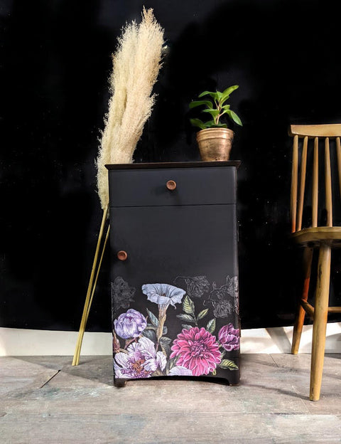 Anchor Silk All-In-One paint is perfect for painting kitchen cabinets, bathroom cabinets and painting furniture. Tall cabinet painted with a base of Anchor Silk All-In-One Mineral Paint and painted flowers. Bronze hardware accents this piece and its staged with willows, a plant and a barstool.