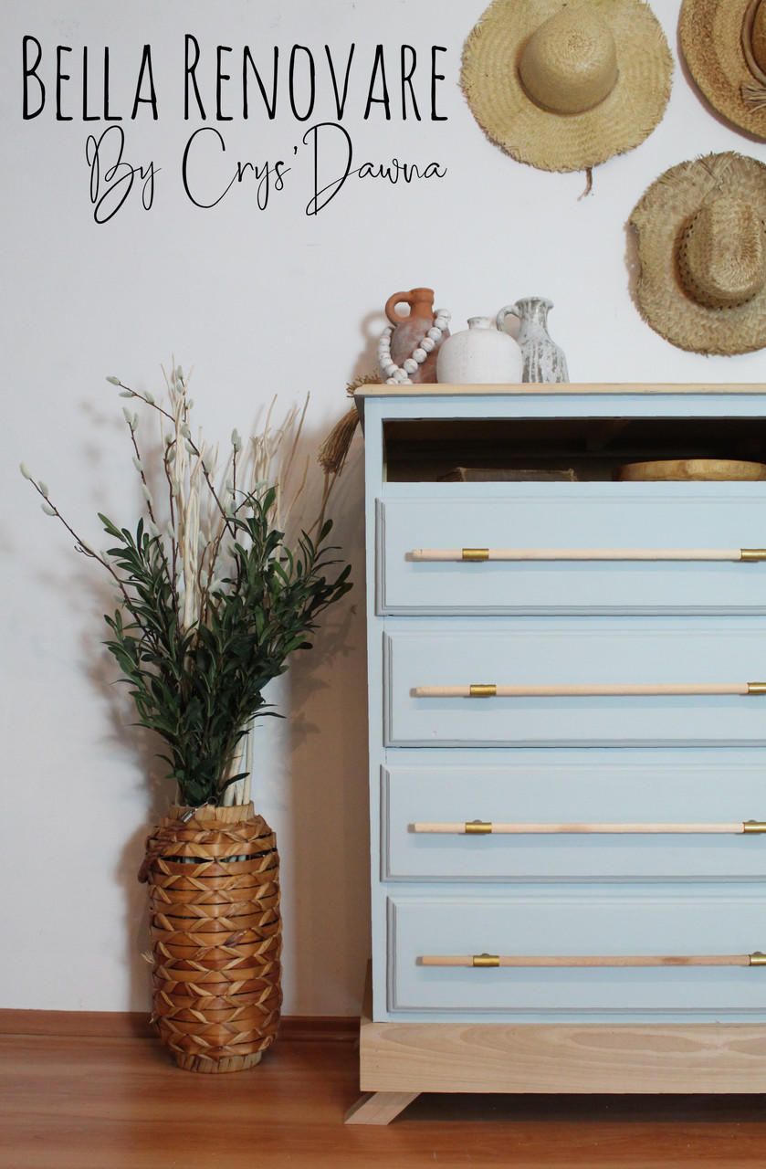 Silk All-In-One Mineral Paint Bay Breeze Silk Paint  is perfect for painting kitchen cabinets, bathroom cabinets and painting furniture.
Tall dresser painted in Bay Breeze Silk Paint with natural wood with gold accent hardware. Staged next to tall woven vase with greenery and straws inside.