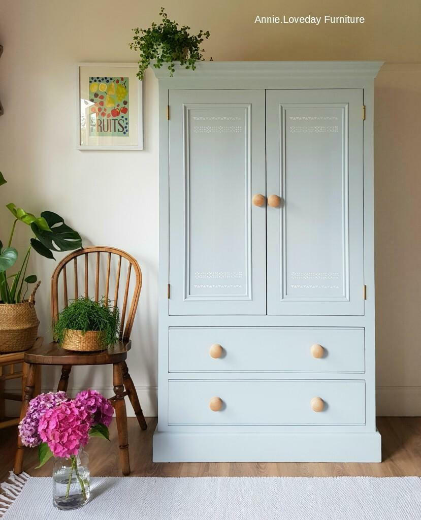 Bay Breeze Silk All-In-One paint is perfect for painting kitchen cabinets, bathroom cabinets and painting furniture
Wardrobe painted with Bay Breeze Silk Paint with natural wood hardware staged with a wooden chair a woven planter with greenery inside and a glass mason jar with pink hydrangeas in front of chair.