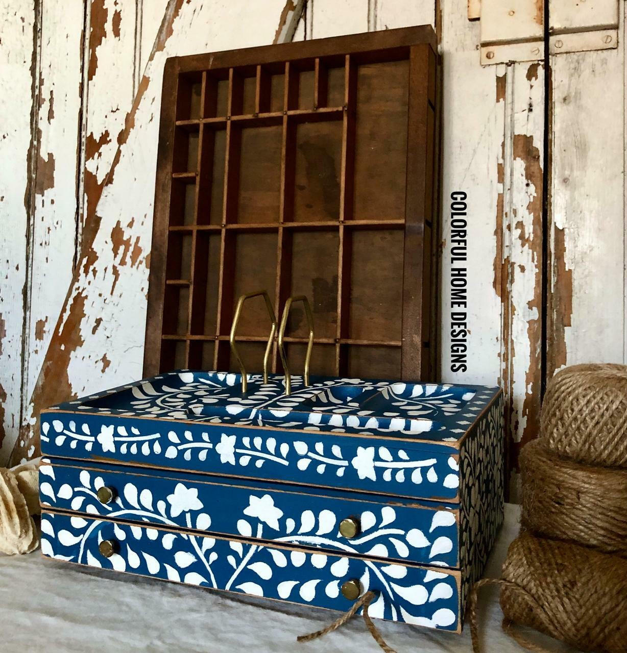 Cape Current Silk All-In-One paint is perfect for painting kitchen cabinets, bathroom cabinets and painting furniture.
Distressed jewelry box painted in Cape Current Silk All-In-One Mineral Paint® with white design. Staged ona rustic white wall and 3 rolls of twine.