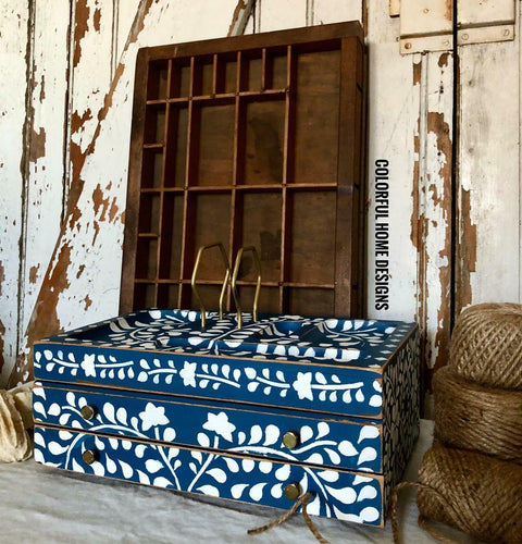 Cape Current Silk All-In-One paint is perfect for painting kitchen cabinets, bathroom cabinets and painting furniture.
Distressed jewelry box painted in Cape Current Silk All-In-One Mineral Paint® with white design. Staged ona rustic white wall and 3 rolls of twine.