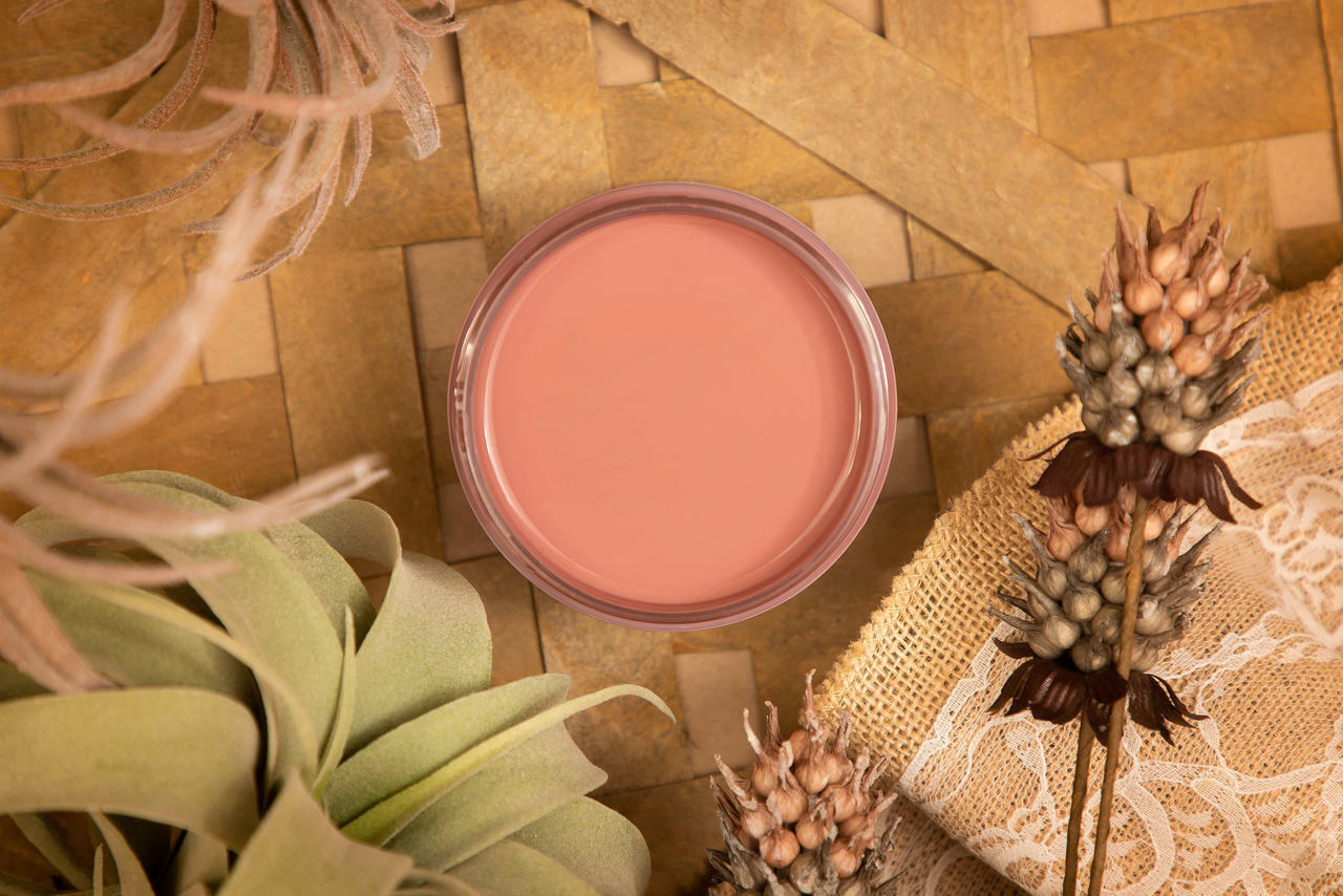 Desert Rose Silk All-In-One paint is perfect for painting kitchen cabinets, bathroom cabinets and painting furniture
This is a picture of the Desert Rose Silk All-In-One paint taken looking directly down on the paint.  Around the paint container are dried leaves and flowers.  It all rests on a wicker mate.  There is a piece of burlap under a dried flower.  The burlap has some white stenciling on top.