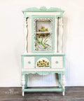 Endless Shore Silk All-In-One paint is perfect for painting kitchen cabinets, bathroom cabinets and painting furniture. White and teal painted armoire. Sunflowers rub on furniture Transfer applied on the front of the drawer and inside the armoire.