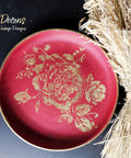 Fiery Sky Silk All-In-One paint is perfect for painting kitchen cabinets, bathroom cabinets and painting furniture.
A shallow bowl painted with Fiery Sky Silk All-In-One paint and Floral - Silkscreen Stencil is seen on the middle of the plate with gold paint. Staged on a black background.