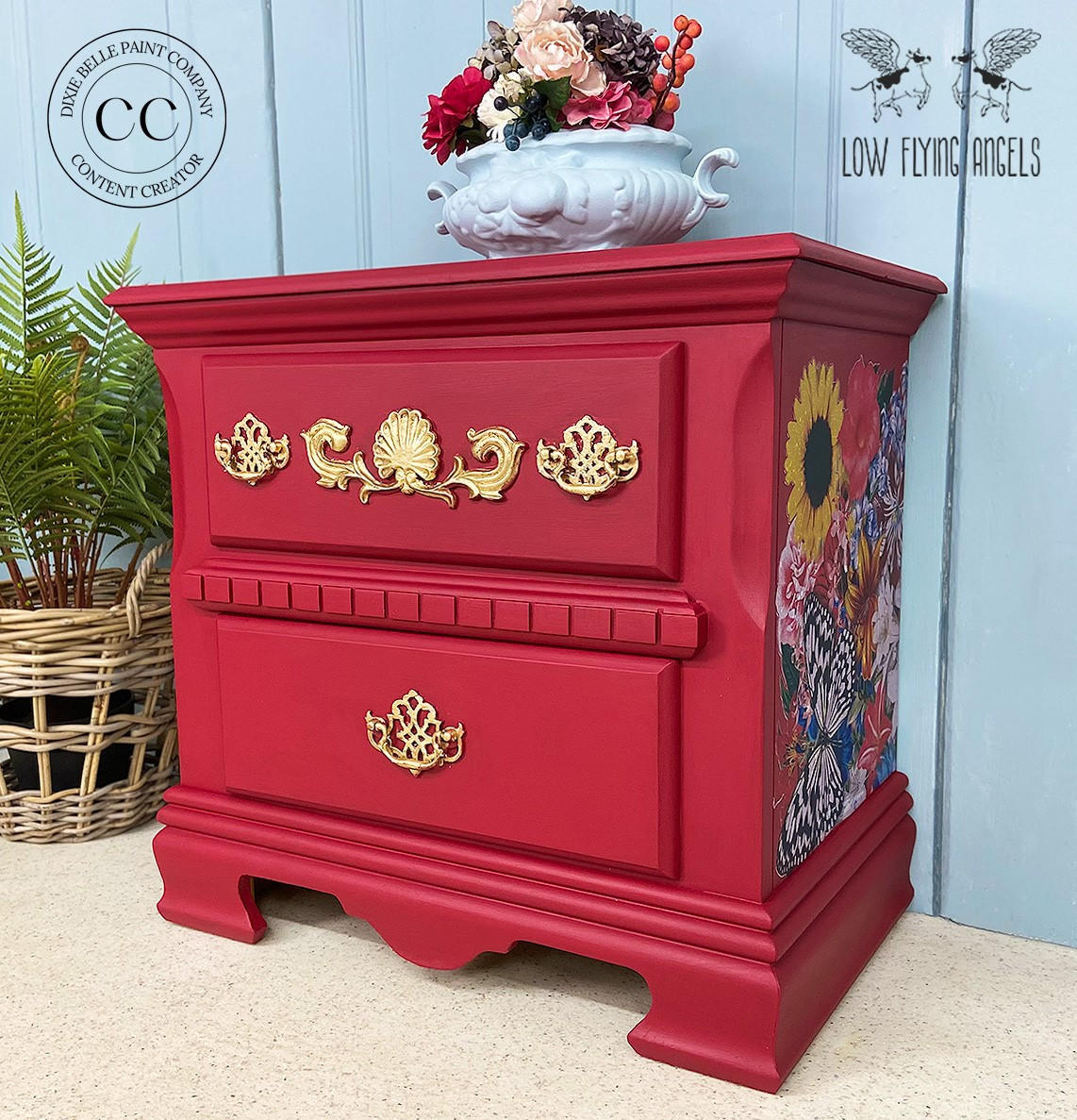 Fiery Sky Silk All-In-One paint is perfect for painting kitchen cabinets, bathroom cabinets and painting furniture.
Bedside table painted in Fiery Sky Silk All-In-One paint with gold hardware and Whimsical Wonderland - Transfer on the side panel of the piece. Staged with a white center bowl with flowers inside.