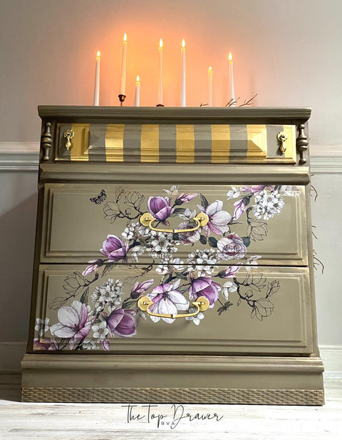 Hampton Olive Silk All-In-One paint is perfect for painting kitchen cabinets, bathroom cabinets and painting furniture.
Dresser painted in Hampton Olive Silk All-In-One paint with Bud & Branches - Transfer from corner to corner. The first drawer has gold stripes and as well as gold hardware. Staged with multiple lit tall candle in candle holders.