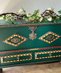 Midnight Green Silk All-In-One paint is perfect for painting kitchen cabinets, bathroom cabinets and painting furniture. Midnight Green Silk All-In-One paint Dark green painted blanket box with red, yellow and orange painted stencils. Staged with an ivy and wood stick.