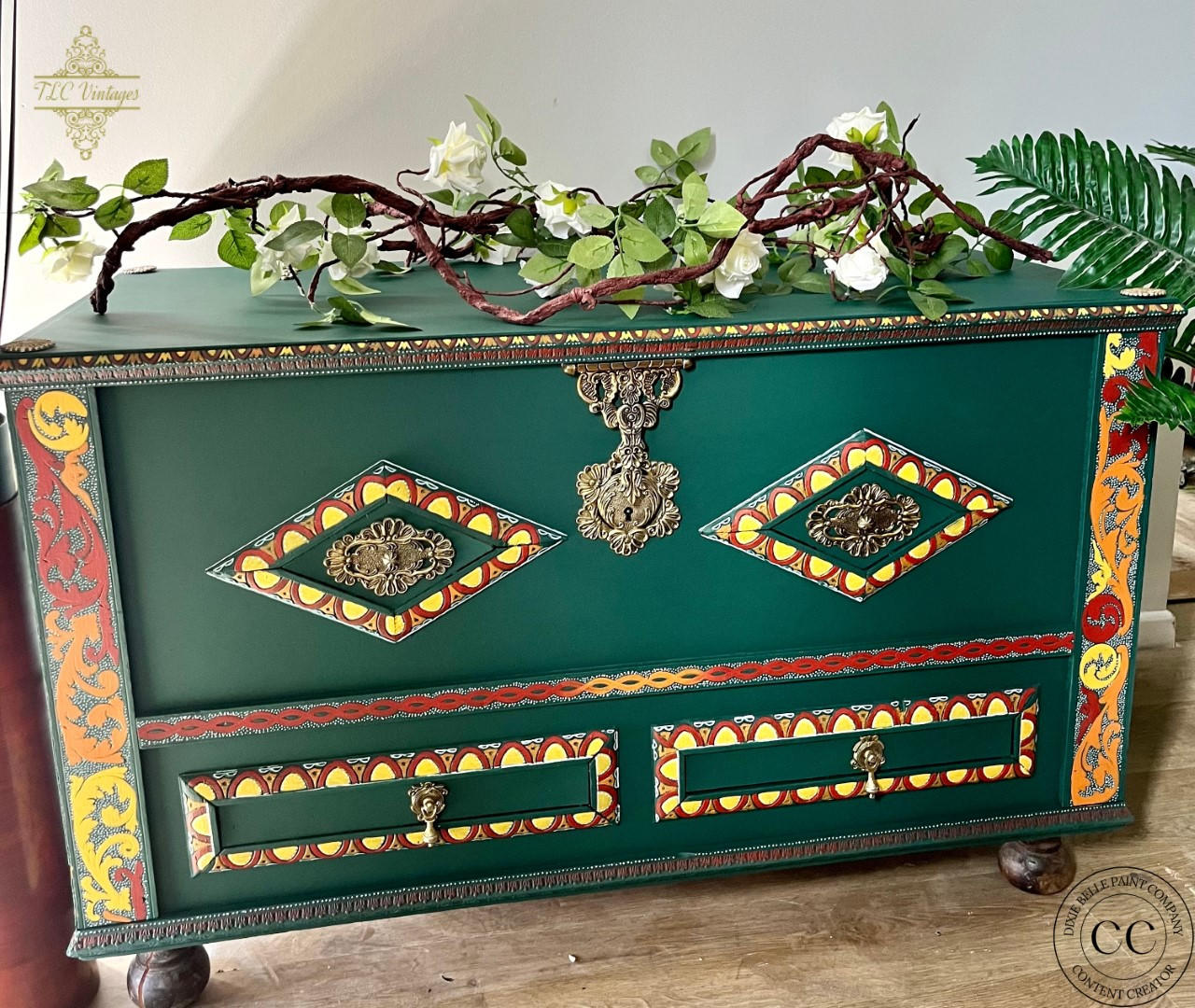 Midnight Green Silk All-In-One paint is perfect for painting kitchen cabinets, bathroom cabinets and painting furniture. Midnight Green Silk All-In-One paint Dark green painted blanket box with red, yellow and orange painted stencils. Staged with an ivy and wood stick.
