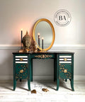 Midnight Green Silk All-In-One paint is perfect for painting kitchen cabinets, bathroom cabinets and painting furniture. Dark green Silk all in one painted desk with cheetah print and black and white stripes on the drawers. Staged with a gold mirror, some candle sticks and buddha heads.