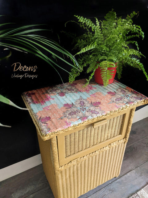 Mojave Silk All-In-One paint is perfect for painting kitchen cabinets, bathroom cabinets and painting furniture. Yellow Silk painted wicker end table with a colorful decoupage paper on top. Staged with potted ferns.