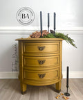 Mojave Silk All-In-One paint is perfect for painting kitchen cabinets, bathroom cabinets and painting furniture. Yellow painted end table with black bee stencils painted on. Staged with black candles, greenery and a bee décor.