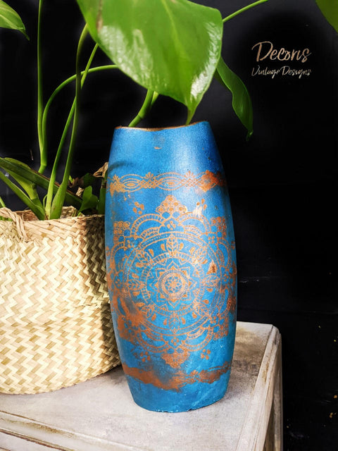 Oasis Silk All-In-One paint is perfect for painting kitchen cabinets, bathroom cabinets and painting furniture. Blue Chalk painted wood floral vase with a painted on Mandala Silkscreen Stencil. Staged with a wicker basket and plant inside.
