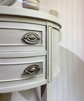 Oyster Silk All-In-One paint is perfect for painting kitchen cabinets, bathroom cabinets and painting furniture. Close up of a white  Silk All-In-One painted end table with silver hardware.