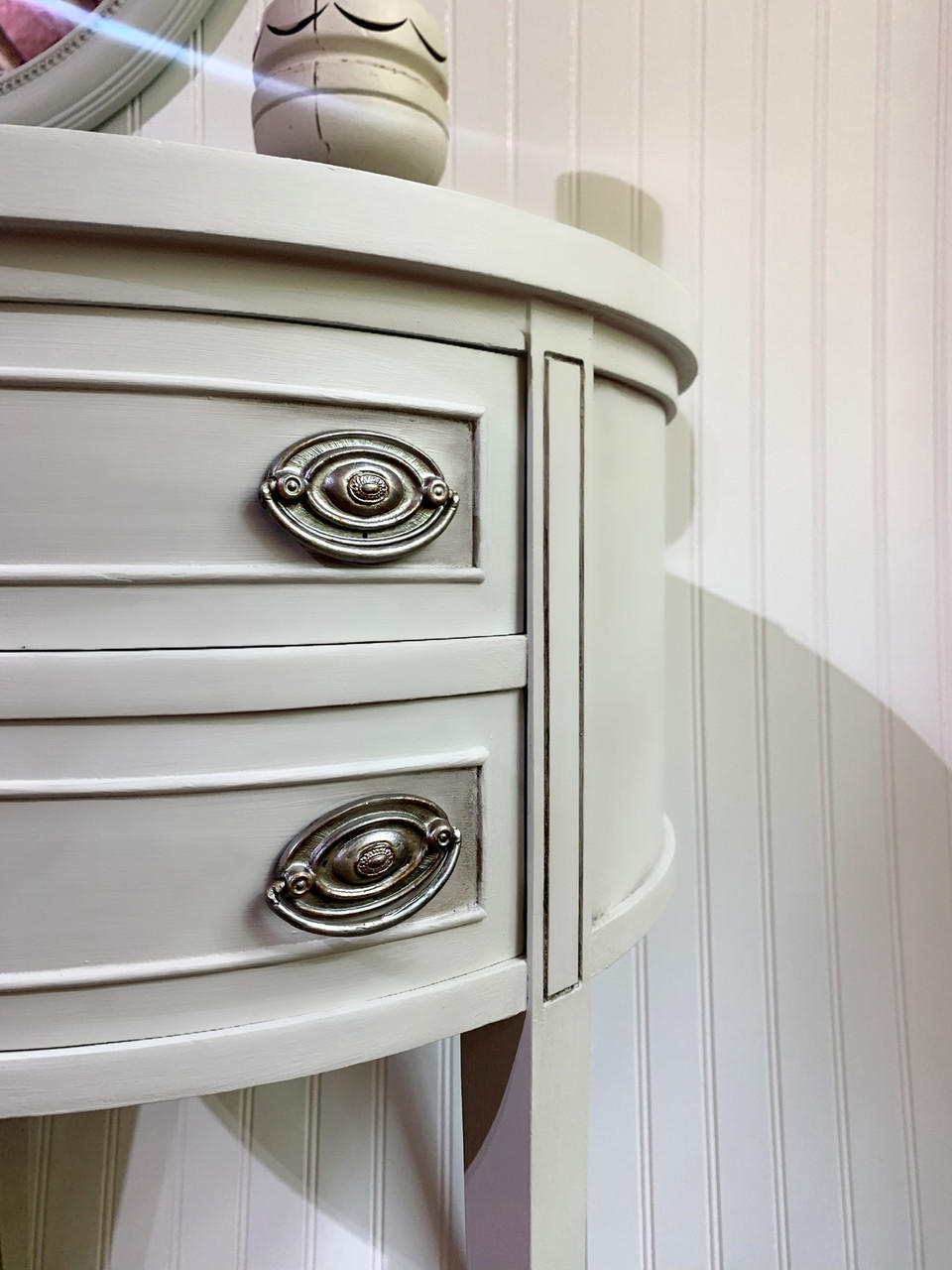Oyster Silk All-In-One paint is perfect for painting kitchen cabinets, bathroom cabinets and painting furniture. Close up of a white  Silk All-In-One painted end table with silver hardware.