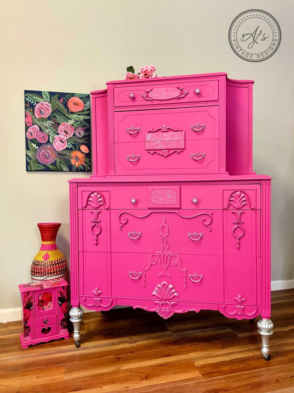Prickly Pear Silk All-In-One paint is perfect for painting kitchen cabinets, bathroom cabinets and painting furniture. Pink chalk painted dresser with silver paint on the trim and legs. Staged with a pink floral jewelry box and colorful wicker  vase.